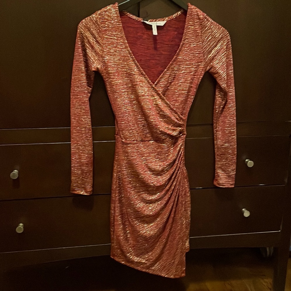 Dark red and gold stretch wrap dress. Figure flattering.